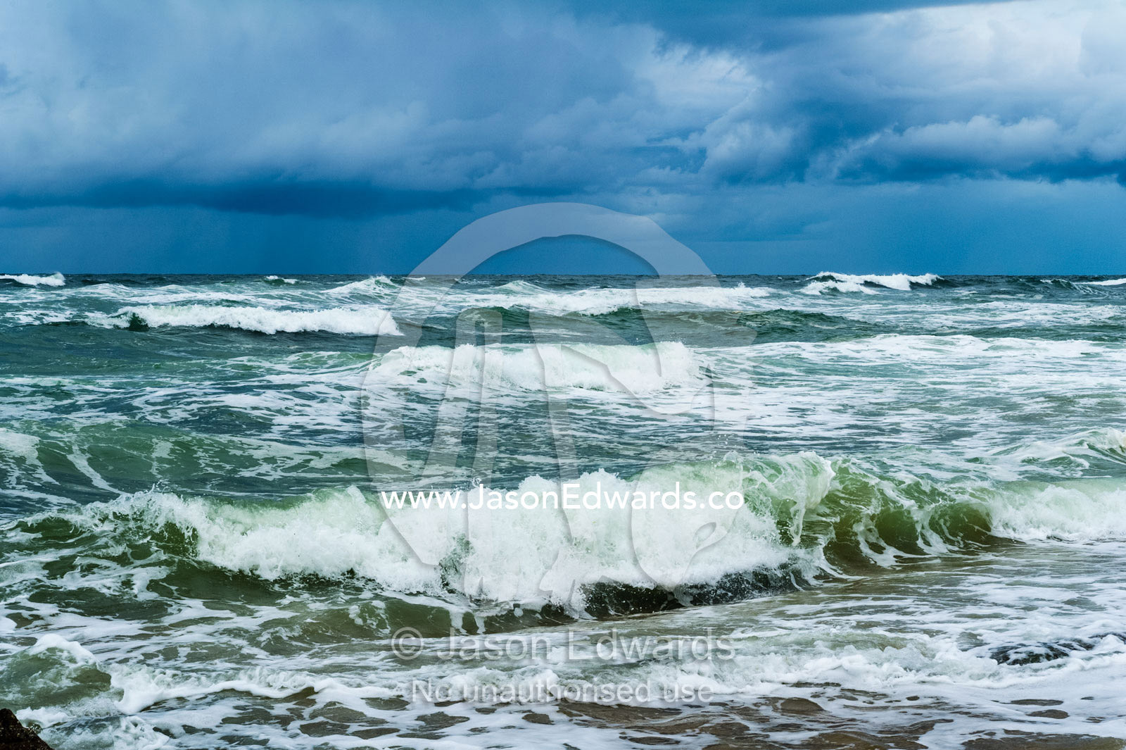 Storm surge waves rolling onto an empty beach. Point Arkwright, Yaroomba Beach, Queensland, Australia.