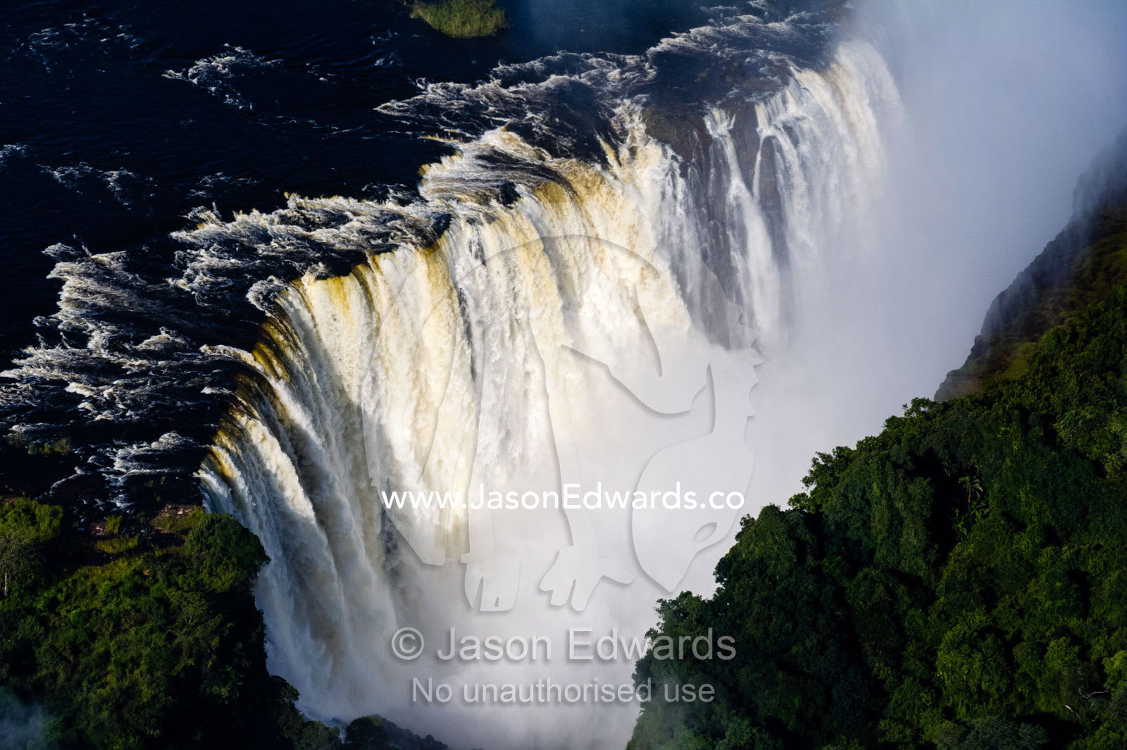 Torrents of water from the Zambezi River cascade over Victoria Falls into the chasm at the Devil's Cataract. Zambezi River, Victoria Falls, Mosi-oa-Tunya National Park, Victoria Falls National Park, Zambia.
