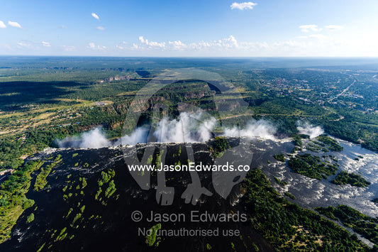 The wide Zambezi River flowing into First Gorge at Victoria Falls. Zambezi River, Victoria Falls, Mosi-oa-Tunya National Park, Victoria Falls National Park, Zambia.
