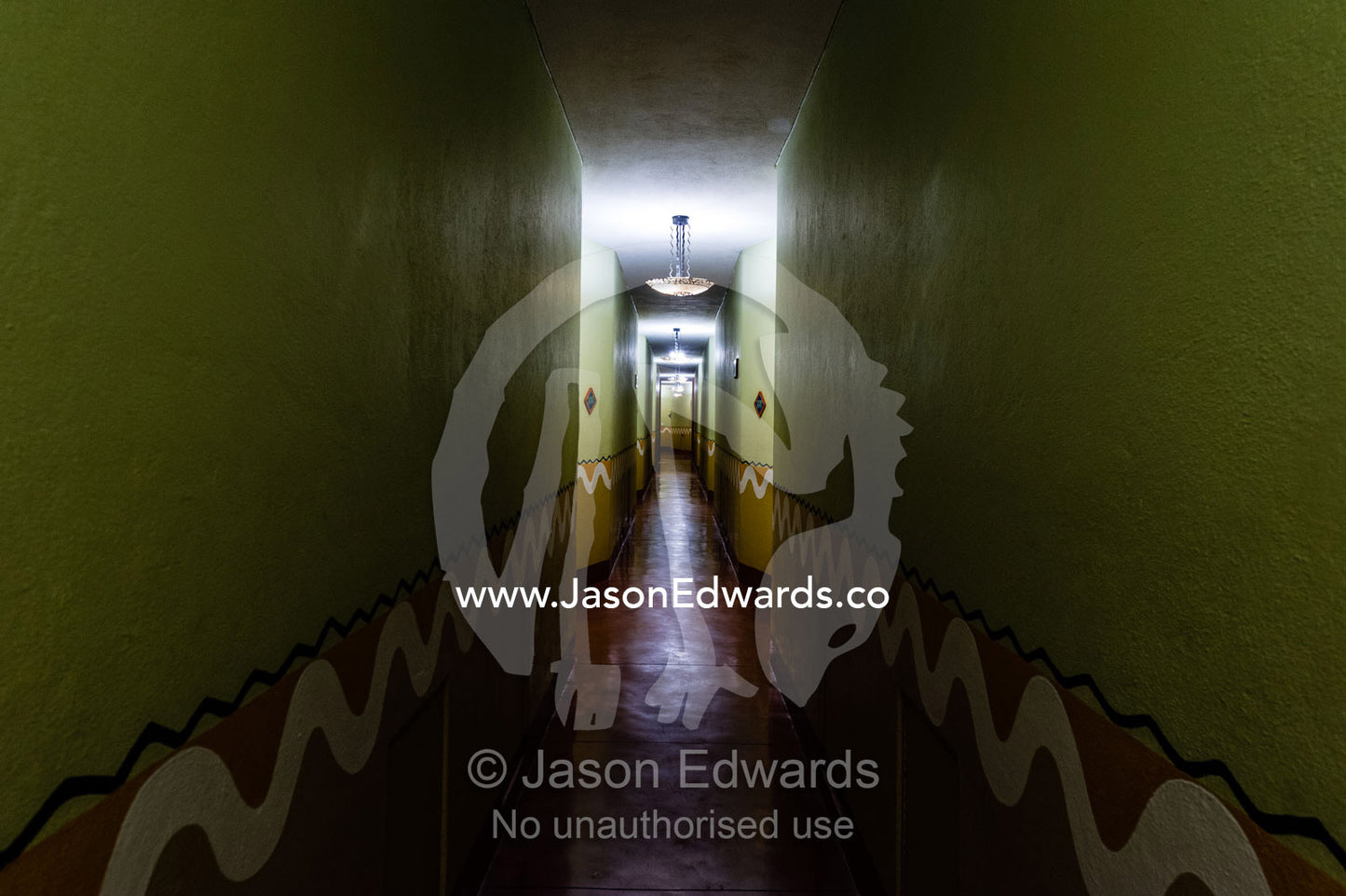 A long straight corridor leading past apartments in a Victoria Falls hotel. Zambezi Sun Hotel, Victoria Falls, Zambia.