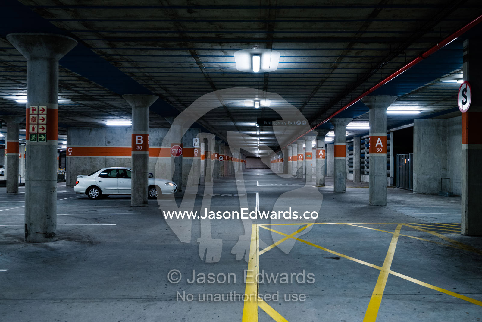 An empty concrete car park at an airport. Cape Town, Western Cape, South Africa.