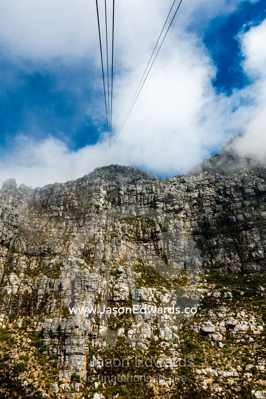 Cable car cables rising to the summit of Table Mountain. Table Mountain, Cape Town, Western Cape, South Africa.