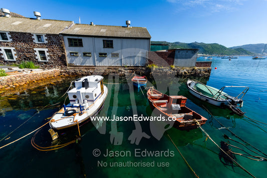 Small fishing boats and punts moored in a tiny bay. Simon's Town Naval Base, Cape Town, False Bay, Cape Peninsula, Chapmans Peak Drive, Western Cape, South Africa.