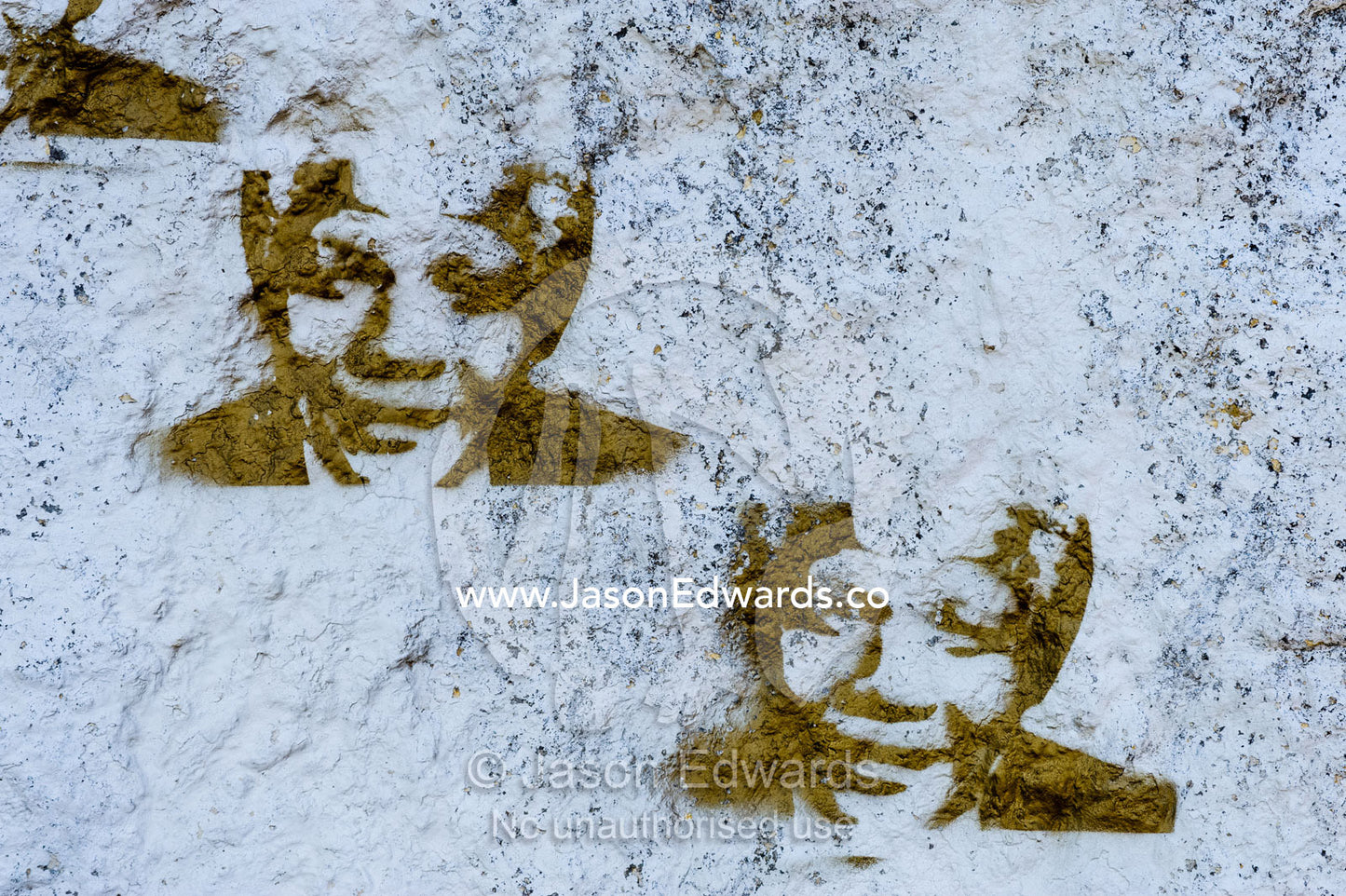 Stencil art graffiti of Nelson Mandela on a roadside boulder. Simon's Town, Cape of Good Hope, Cape Point, Table Mountain National Park, Cape Peninsula, South Africa.