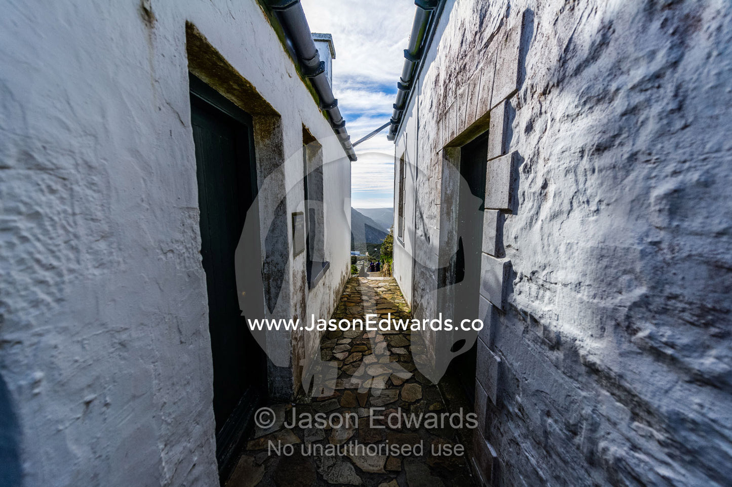 Whitewashed historic buildings at the Cape Point Lighthouse offer a glimpse into bygone maritime era. Cape of Good Hope, Cape Point, Table Mountain National Park, Cape Peninsula, South Africa.