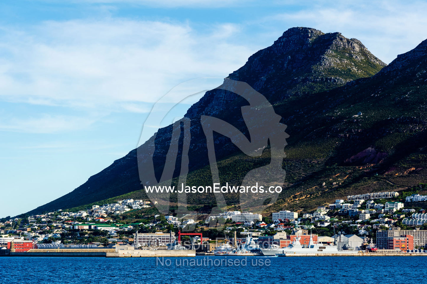 A naval base and fishing town nestled beneath a mountain. Simon's Town Naval Base, Cape Town, False Bay, Cape Peninsula, Chapmans Peak Drive, Western Cape, South Africa.