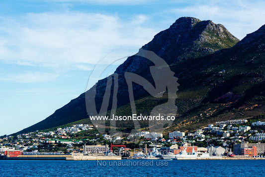 A naval base and fishing town nestled beneath a mountain. Simon's Town Naval Base, Cape Town, False Bay, Cape Peninsula, Chapmans Peak Drive, Western Cape, South Africa.
