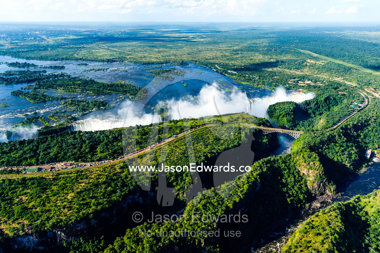 An aerial view of a winding gorge carved into a flat plain by the Zambezi River. Zambezi River, Victoria Falls, Mosi-oa-Tunya National Park, Victoria Falls National Park, Zambia.