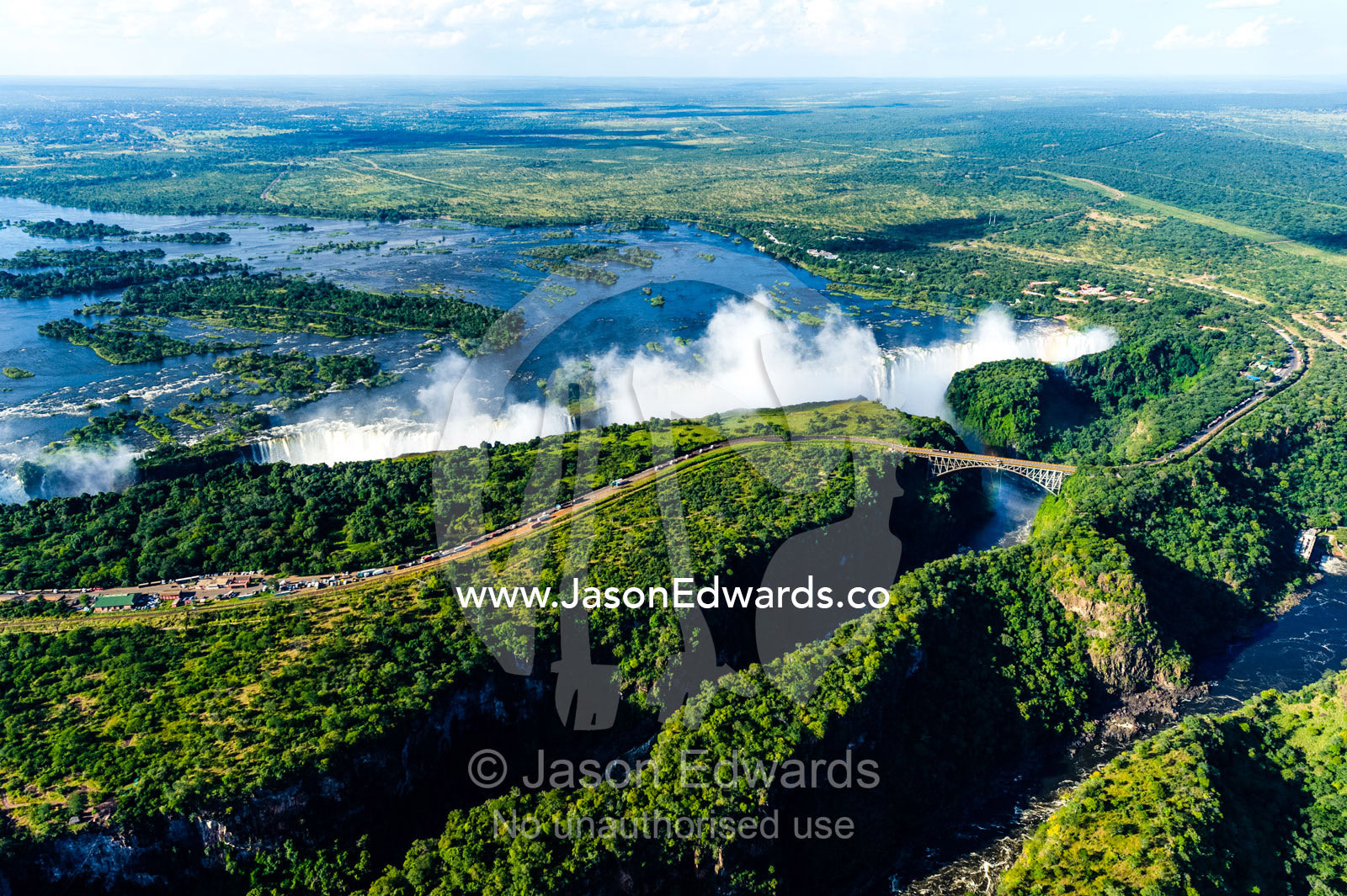An aerial view of a winding gorge carved into a flat plain by the Zambezi River. Zambezi River, Victoria Falls, Mosi-oa-Tunya National Park, Victoria Falls National Park, Zambia.