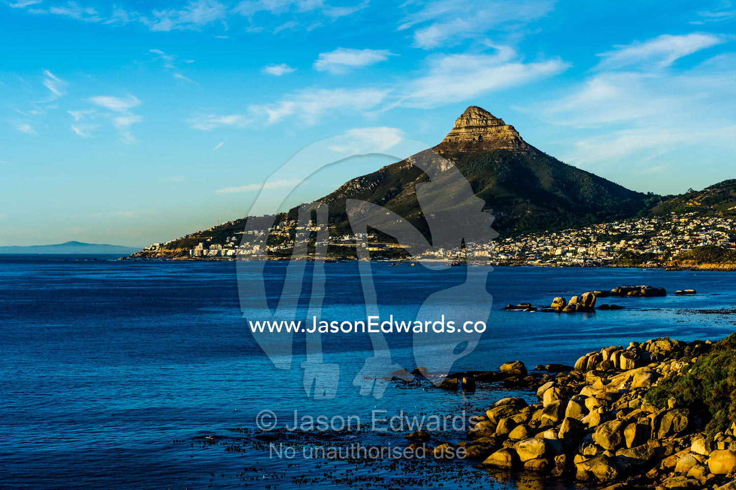 Sunset falls on Cape Town and the Lion's Head overlooking Table Bay. Lion's Head, Cape Town, Western Cape, South Africa.