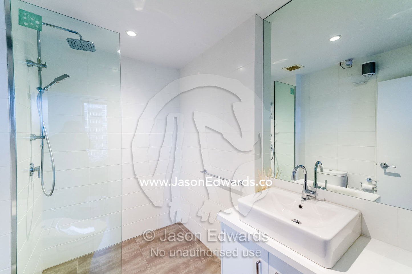 A modern bathroom wash basin and shower in an inner city apartment. St Kilda, Melbourne, Victoria, Australia.