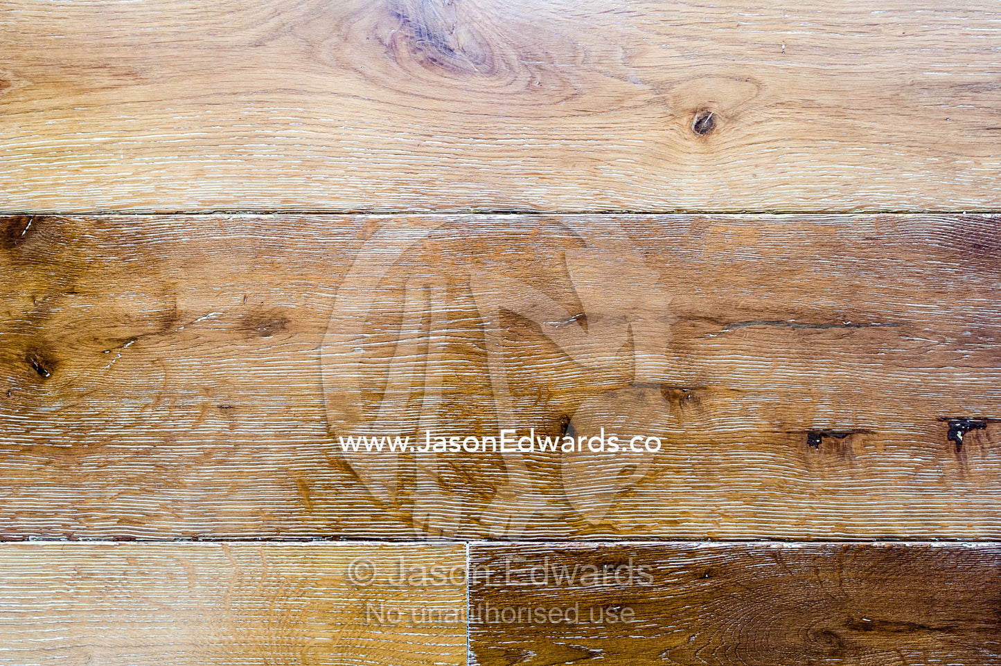 A textured detail of polished floorboards in an apartment. St Kilda, Melbourne, Victoria, Australia.