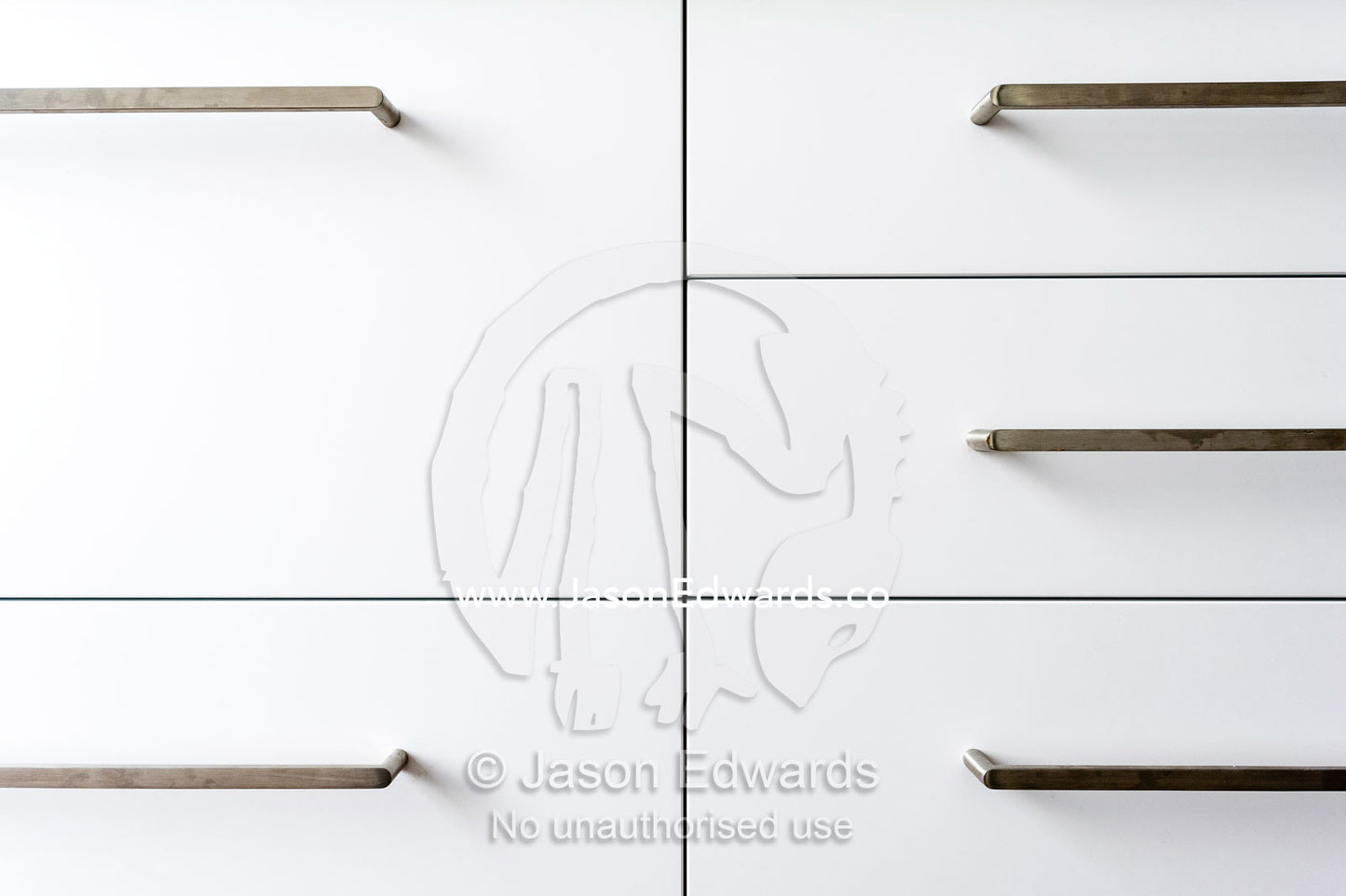 The joinery and handles on kitchen draws in an inner city apartment. St Kilda, Melbourne, Victoria, Australia.