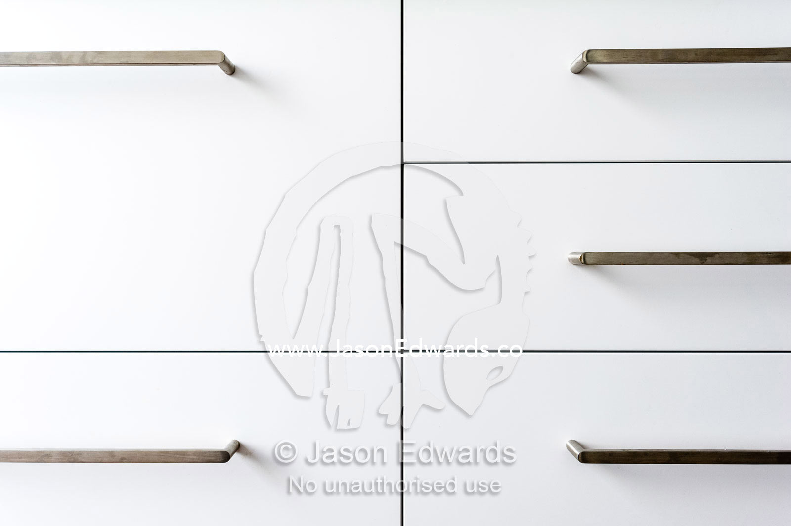 The joinery and handles on kitchen draws in an inner city apartment. St Kilda, Melbourne, Victoria, Australia.