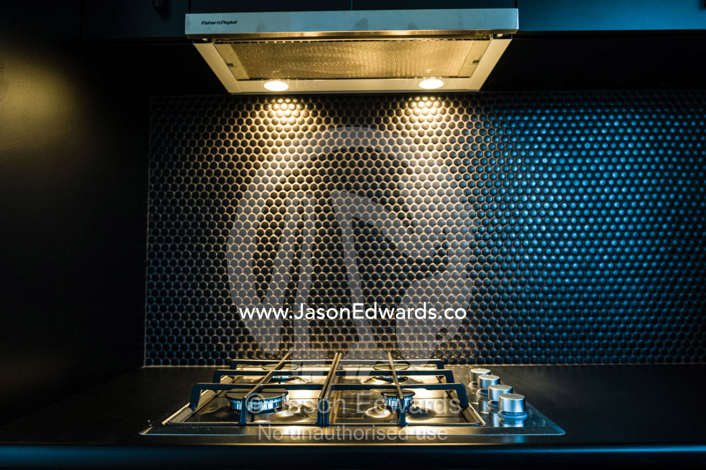 A black modern oven and range cooker in a kitchen in an inner city apartment. Brunswick, Melbourne, Victoria, Australia.