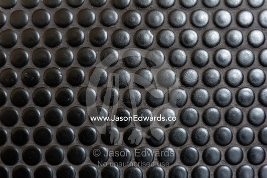 A circular tiled wall acts as a splash back behind a range cooker in an inner city apartment. Brunswick, Melbourne, Victoria, Australia.