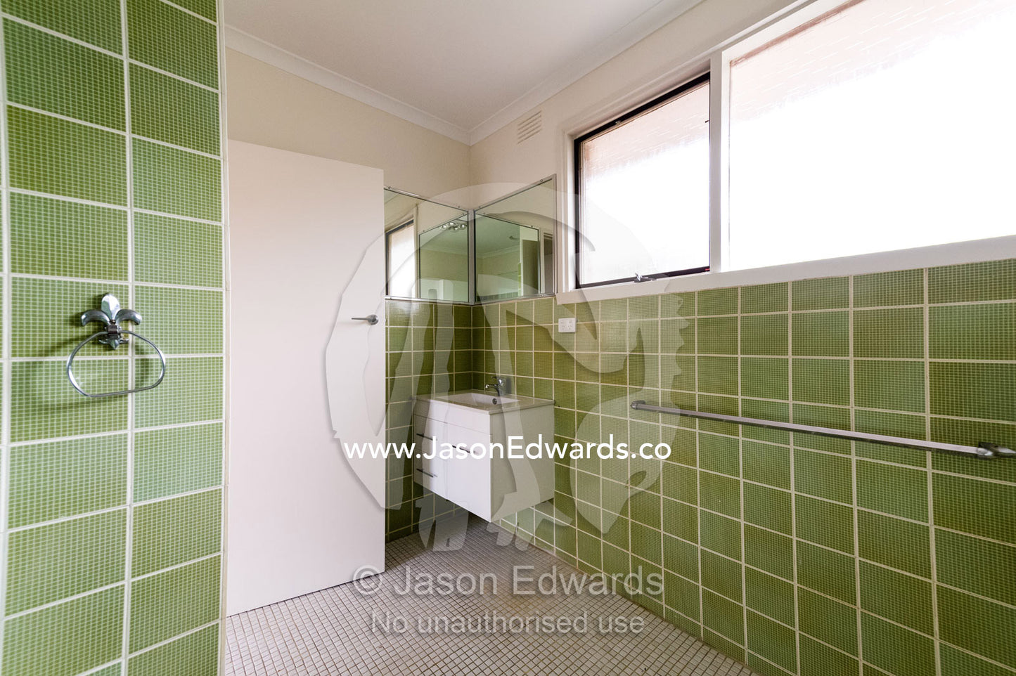 A tiled bathroom and laundry in an inner city apartment. Brunswick, Melbourne, Victoria, Australia.