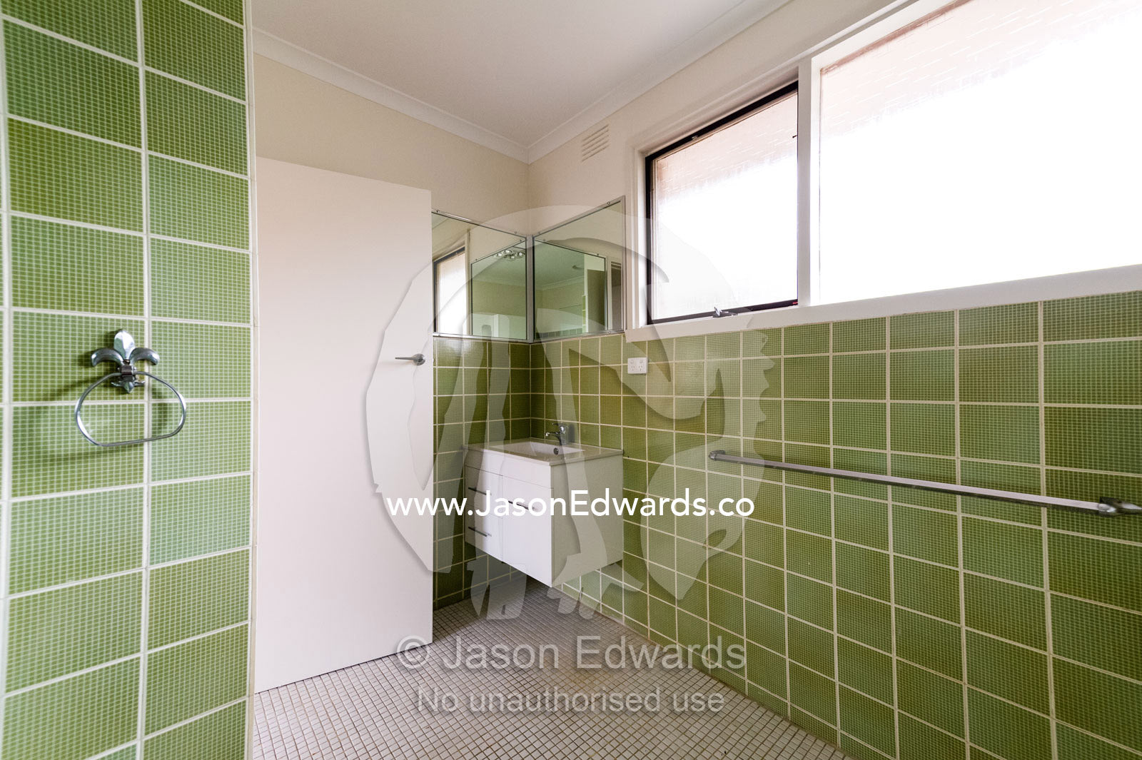 A tiled bathroom and laundry in an inner city apartment. Brunswick, Melbourne, Victoria, Australia.