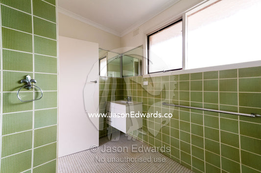 A tiled bathroom and laundry in an inner city apartment. Brunswick, Melbourne, Victoria, Australia.