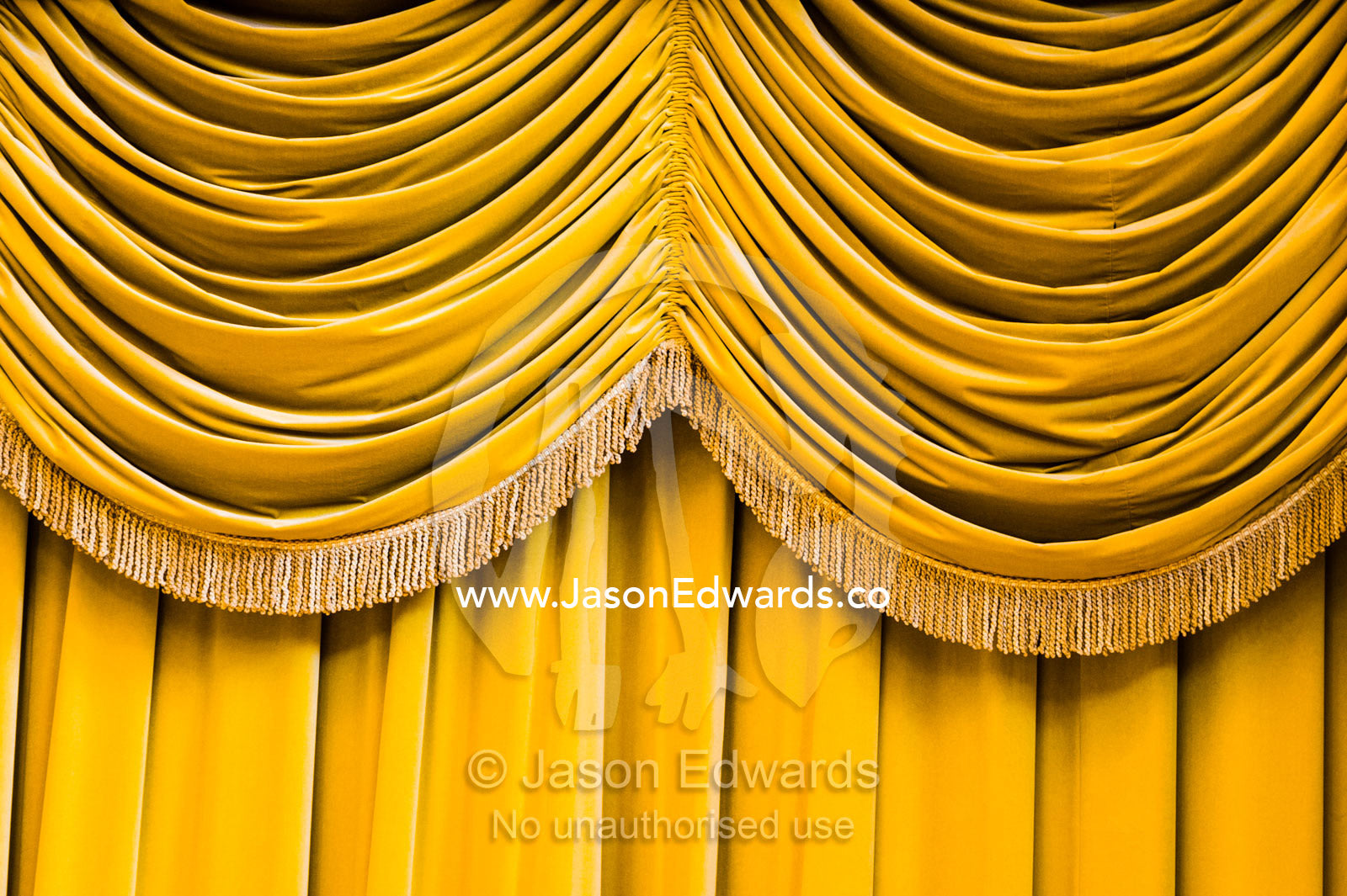 Velvet curtains in heritage listed theatre. Northcote Town Hall, Melbourne, Victoria, Australia.