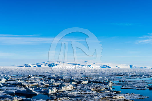 Ocean melt ponds expand where the Antarctic sea ice is melting in summer. Haskell Strait, McMurdo Sound, Ross Island, Antarctica