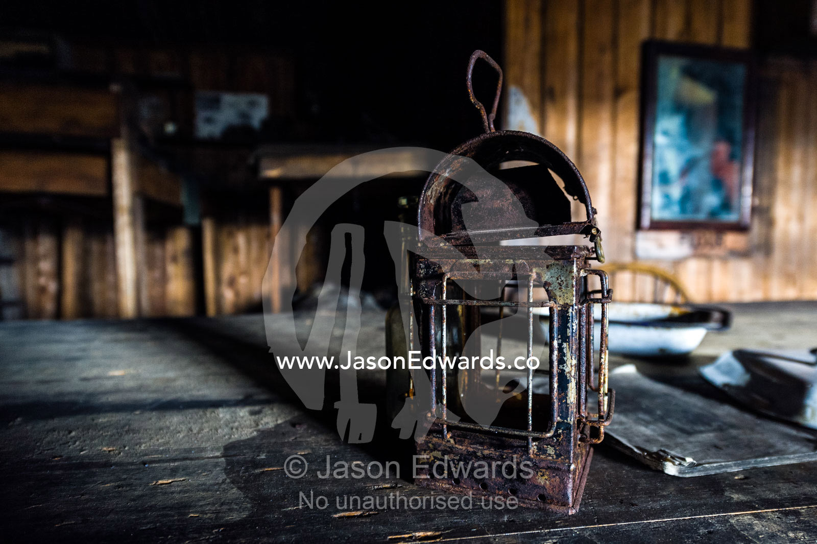 A rusting lantern on the wardroom table in the hut of Antarctic explorer Robert Falcon Scott. Scott's Hut, Cape Evans, Ross Island, Antarctica.