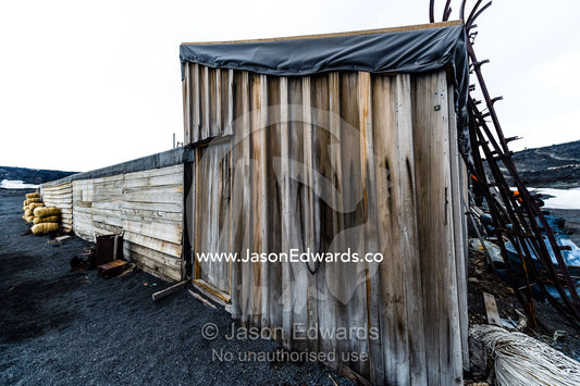 The weathered walls and window shutters of the Antarctic explorer Robert Falcon Scott's hut. Scott's Hut, Cape Evans, Ross Island, Antarctica.