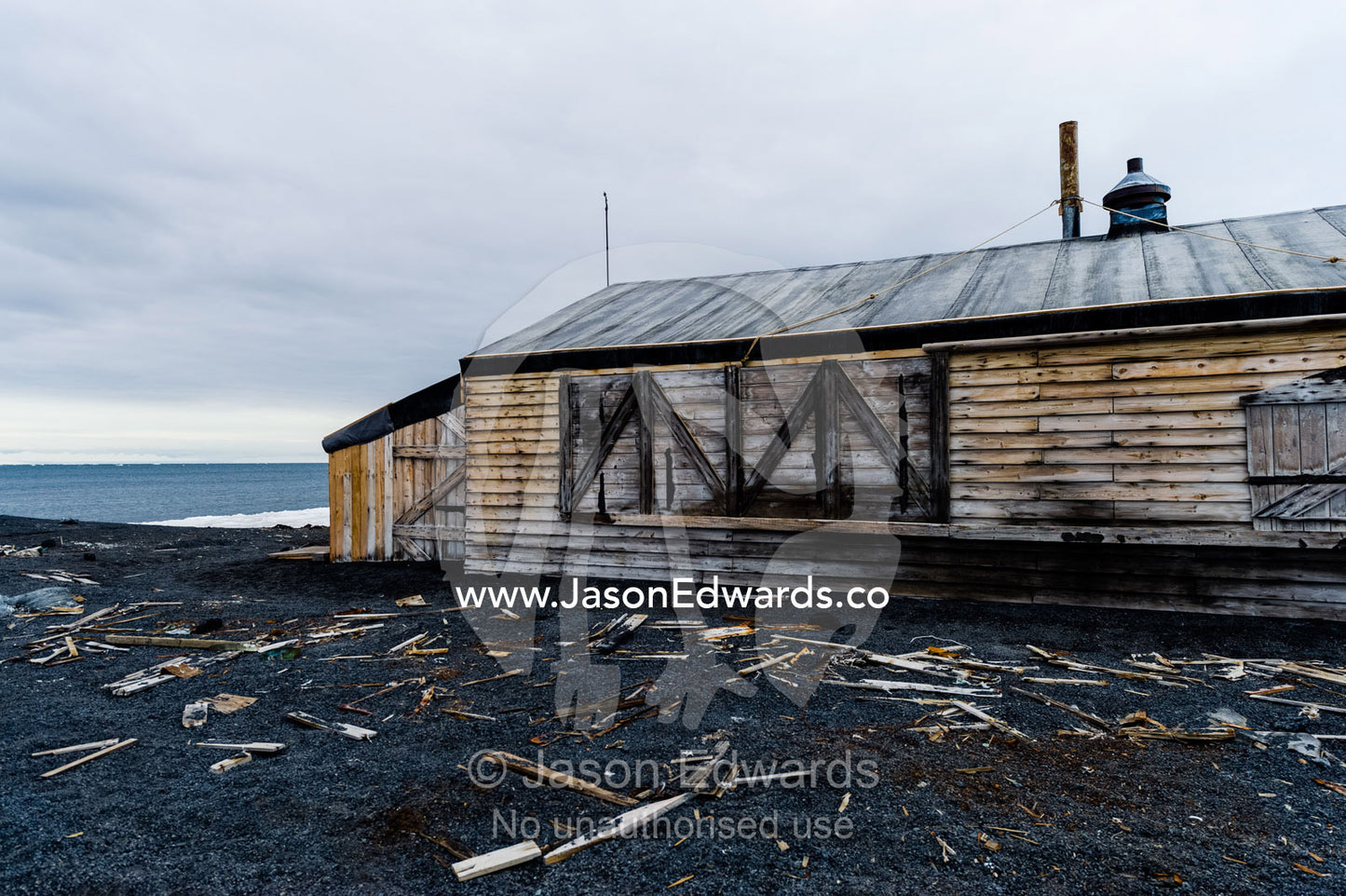 The weathered walls and window shutters of the Antarctic explorer Robert Falcon Scott's hut. Scott's Hut, Cape Evans, Ross Island, Antarctica.