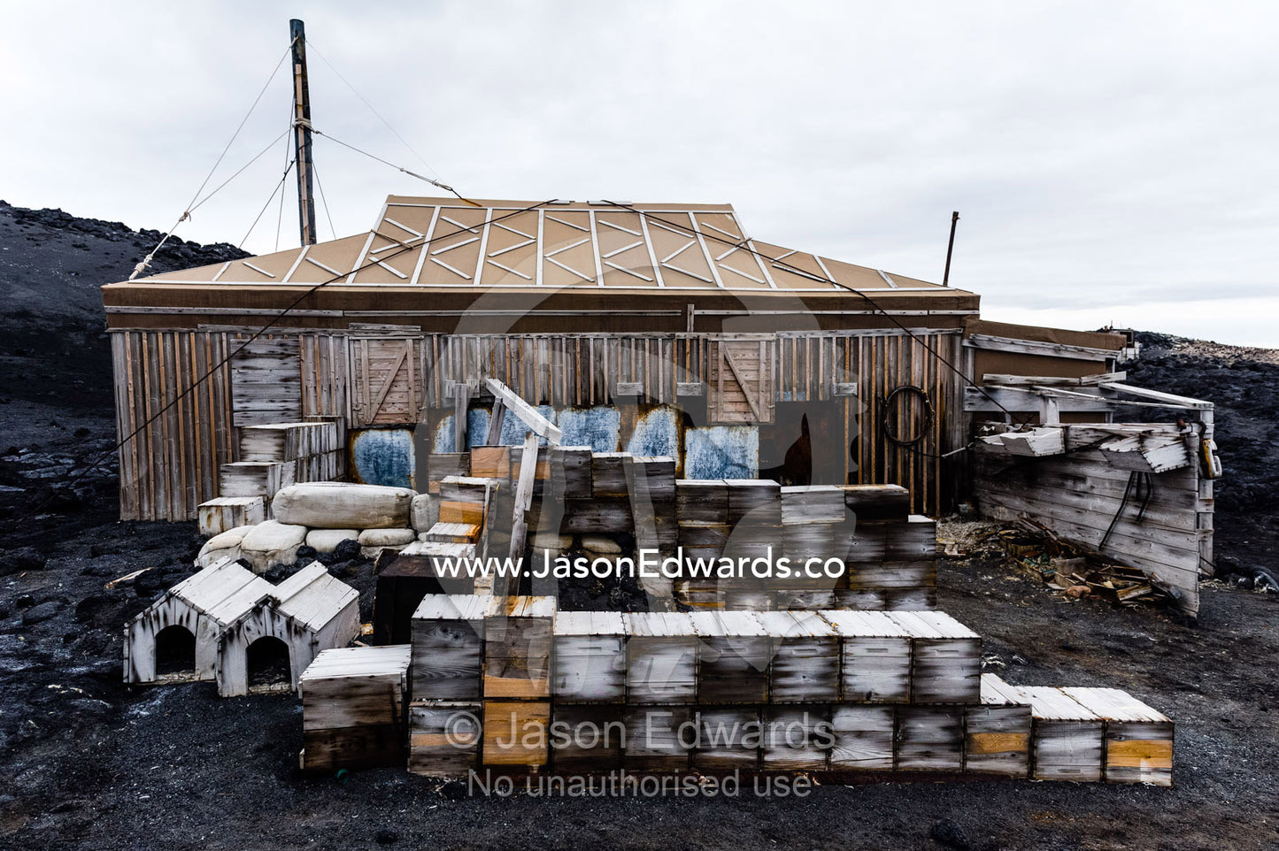 Food supply, storage boxes and dog kennels outside the hut of Antarctic explorer Ernest Shackleton. Shackleton's Hut, Cape Royds, Ross Island, Antarctica.