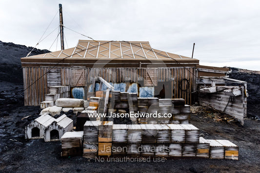 Food supply, storage boxes and dog kennels outside the hut of Antarctic explorer Ernest Shackleton. Shackleton's Hut, Cape Royds, Ross Island, Antarctica.