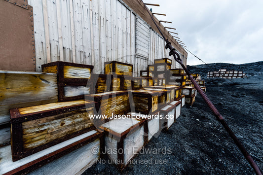 Food supplies and storage boxes outside the hut of Antarctic explorer Ernest Shackleton. Shackleton's Hut, Cape Royds, Ross Island, Antarctica.
