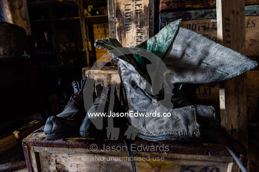 Unlaced leather boots in Antarctic explorer Ernest Shackelton's hut. Shackleton's Hut, Cape Royds, Ross Island, Antarctica.