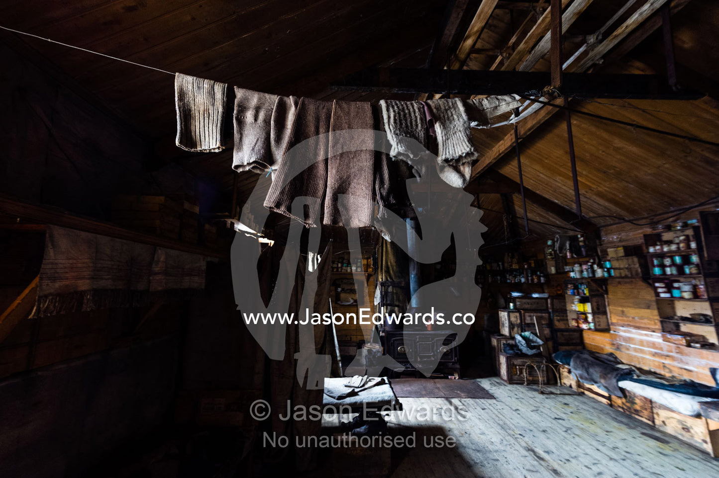Woolen socks hanging from a clothes line above a bunk bed in Antarctic explorer Ernest Shackleton's hut. Shackleton's Hut, Cape Royds, Ross Island, Antarctica.