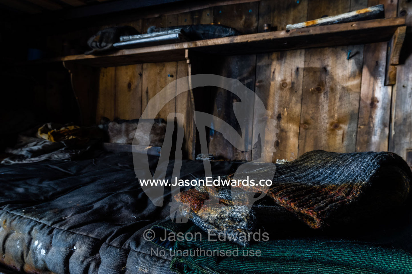 Woollen socks resting on a bunk bed in the hut of Antarctic explorer Robert Falcon Scott. Scott's Hut, Cape Evans, Ross Island, Antarctica.
