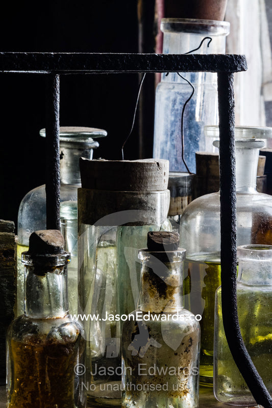 Glass pipettes, beakers and other scientific experiment equipment in the hut of Antarctic explorer Robert Falcon Scott. Scott's Hut, Cape Evans, Ross Island, Antarctica.