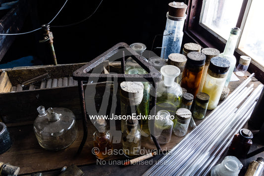 Glass pipettes, beakers and other scientific experiment equipment in the hut of Antarctic explorer Robert Falcon Scott. Scott's Hut, Cape Evans, Ross Island, Antarctica.