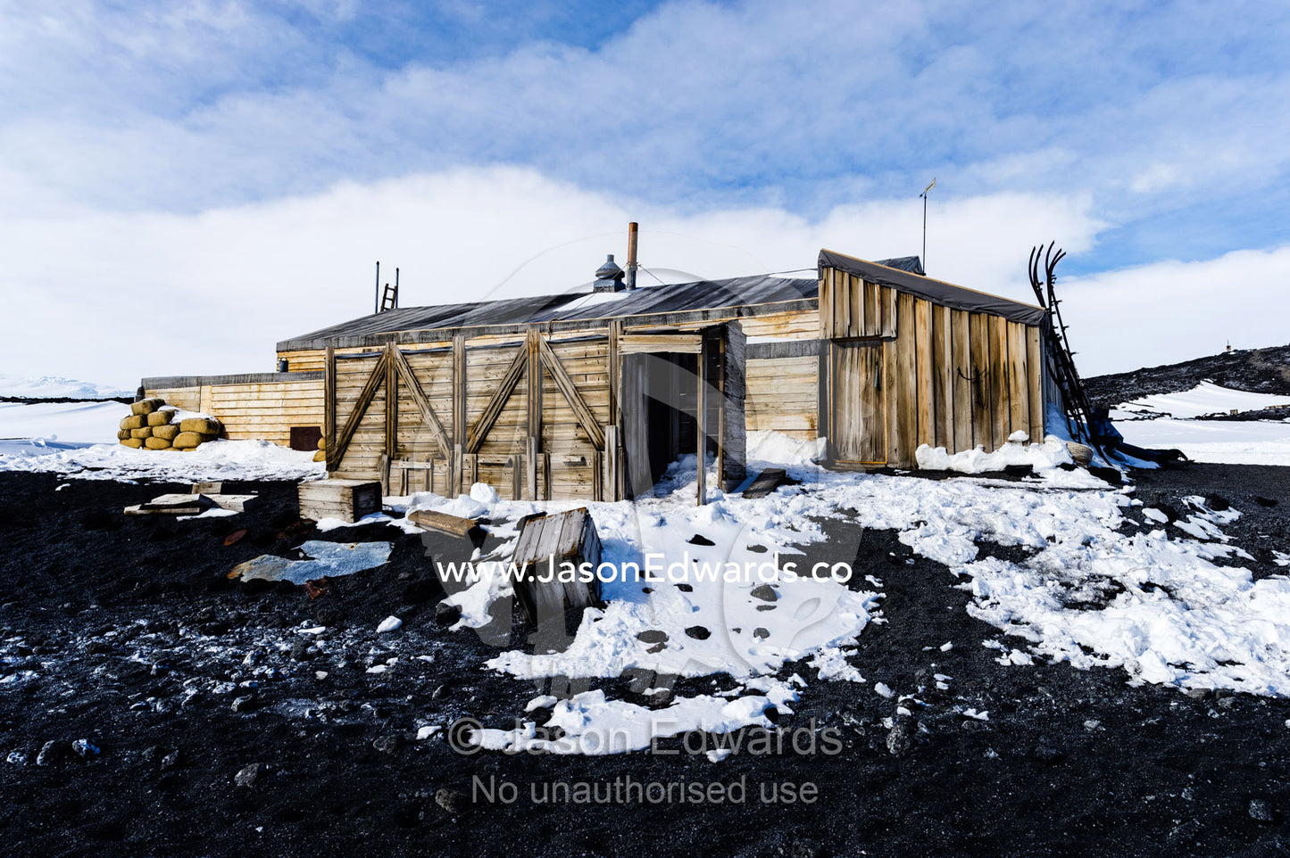 The weathered walls and supply boxes of the Antarctic explorer Robert Falcon Scott's hut. Scott's Hut, Cape Evans, Ross Island, Antarctica.