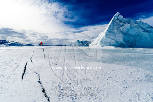 Cracks appear in melting sea ice during the summer in Antarctica. Erebus Bay, McMurdo Sound, Cape Evans, Ross Island Antarctica.