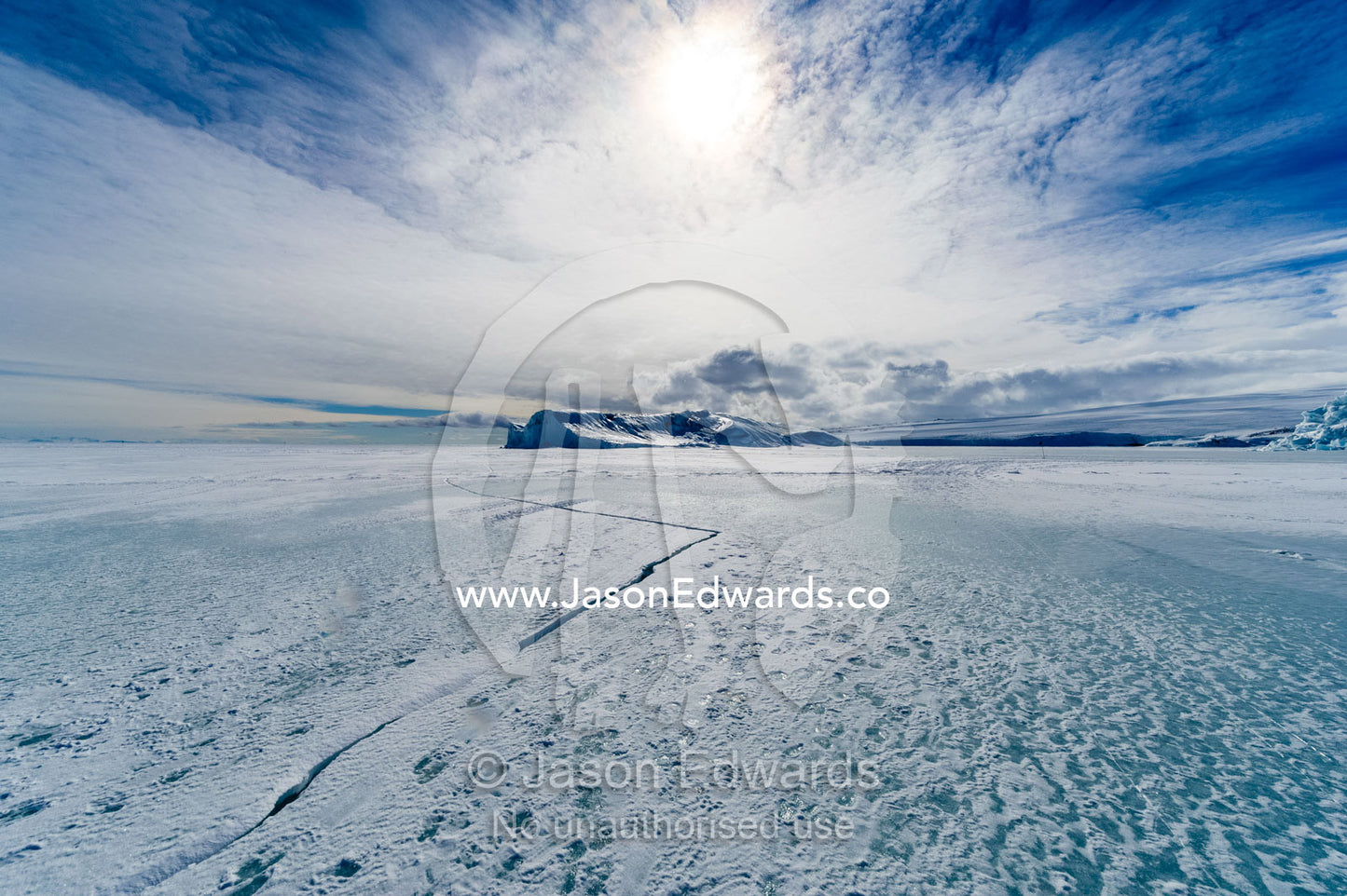 Cracks appear in melting sea ice during the summer in Antarctica. Erebus Bay, McMurdo Sound, Cape Evans, Ross Island Antarctica.