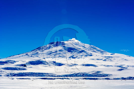 The smoking summit of Mount Erebus an active volcano in Antarctica. Mount Erebus, Ross Island, Antarctica.