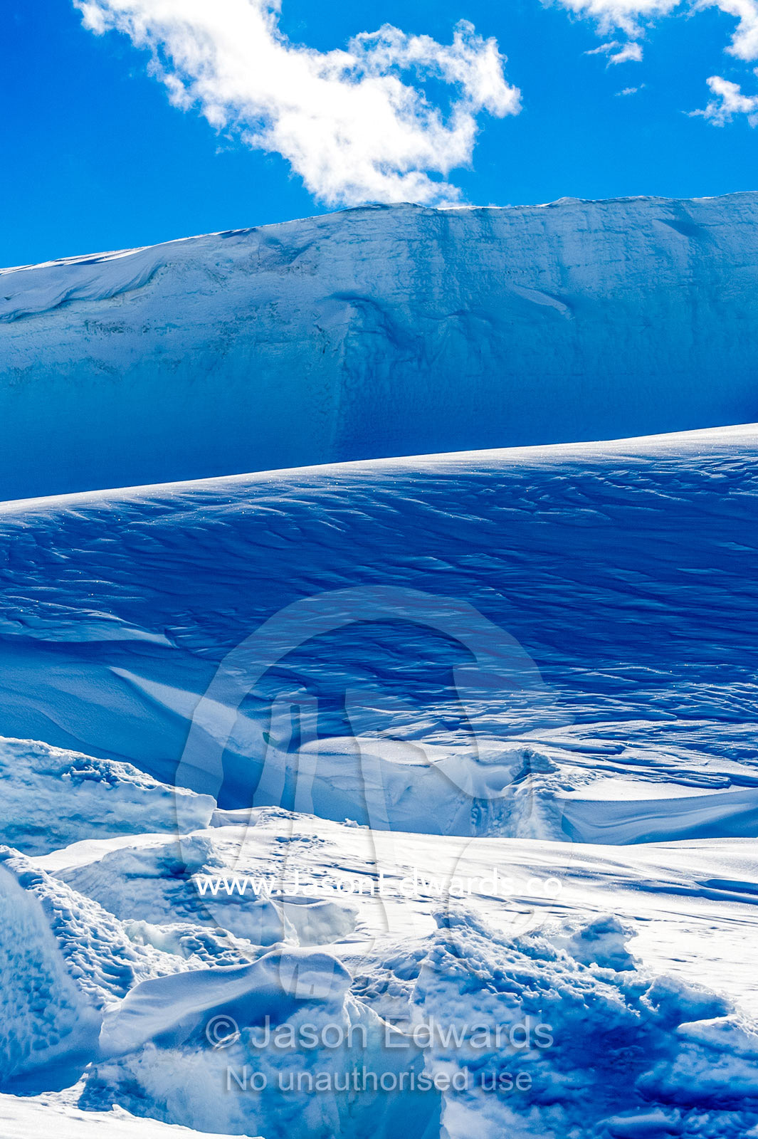The sheer cliffs of the Erebus glacier tongue in Antarctica. Erebus Ice Caves, Mount Erebus, Ross Island, Antarctica.