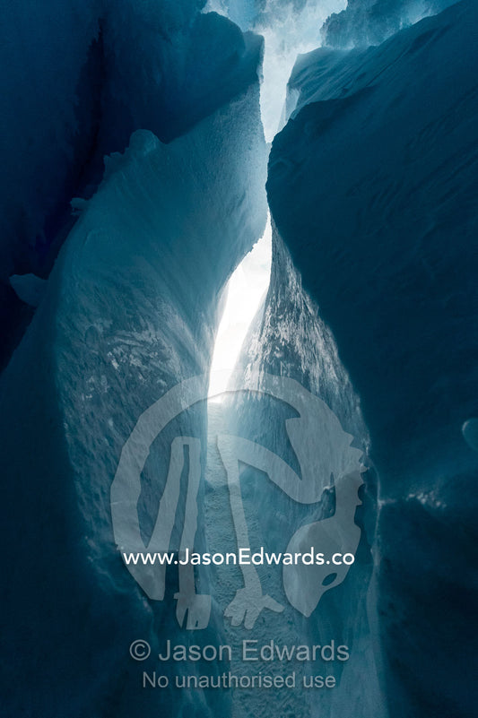 The frozen ceiling and icy walls of an ice cave in the Erebus Glacier Tongue. Erebus Ice Caves, Mount Erebus, Ross Island, Antarctica.