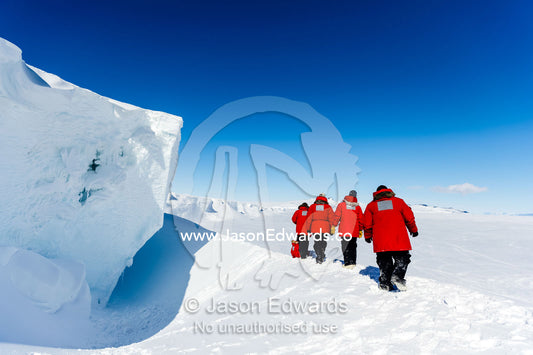 Staff from McMurdo Station exploring an ice cave in the Erebus Glacier Tongue. Erebus Ice Caves, Mount Erebus, Ross Island, Antarctica.