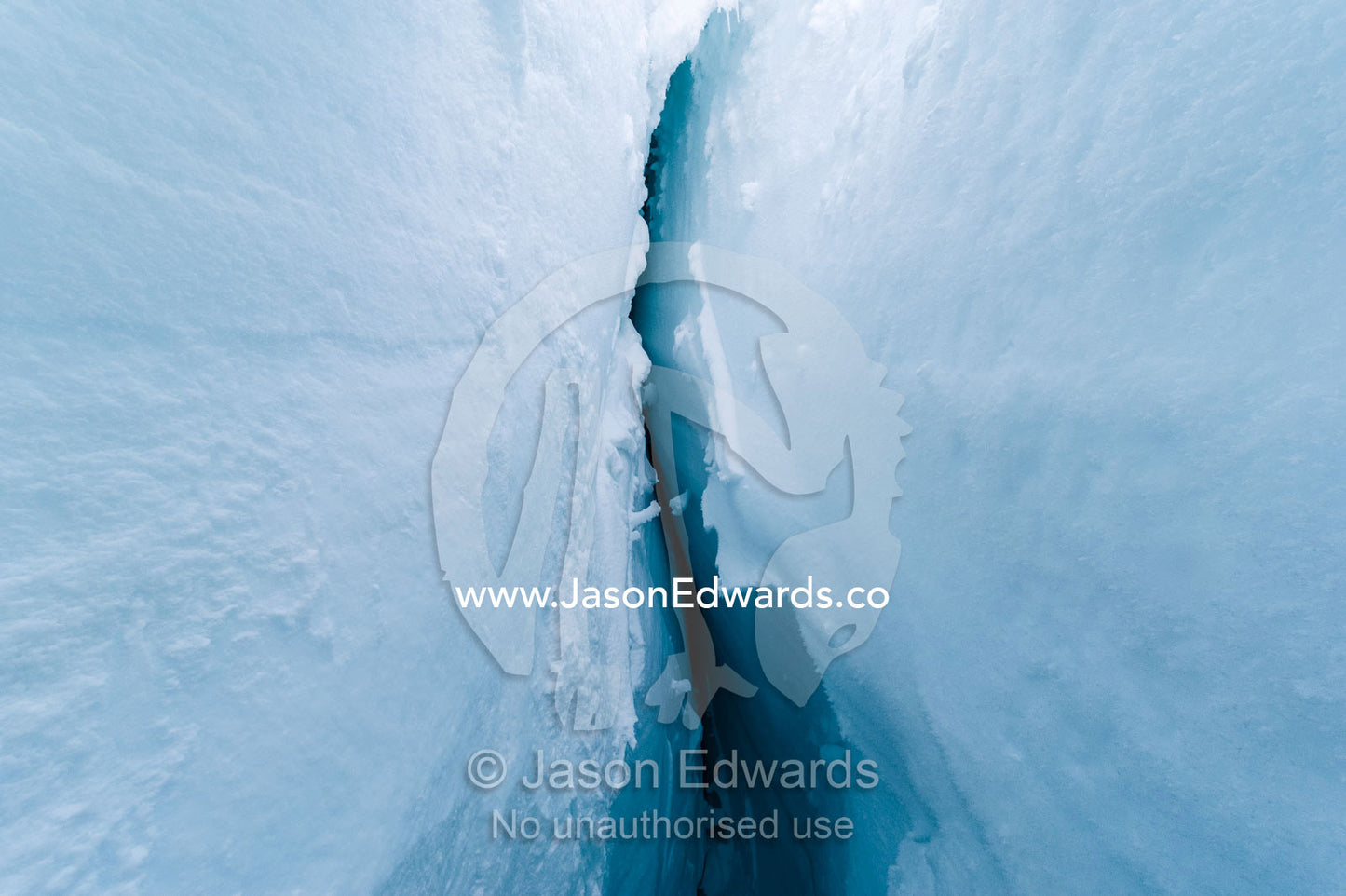 The caverness and sheer icy walls of a crevasse on the slopes of Mount Erebus in Antarctica. Silver City Ice Fall, Hut Point Peninsula, Ross Island Antarctica.