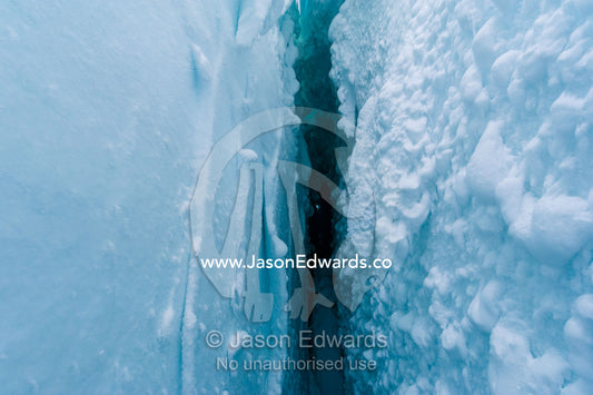 Snow crystals on the cavernous and sheer icy walls of a crevasse on the slopes of Mount Erebus in Antarctica. Silver City Ice Fall, Hut Point Peninsula, Ross Island Antarctica.