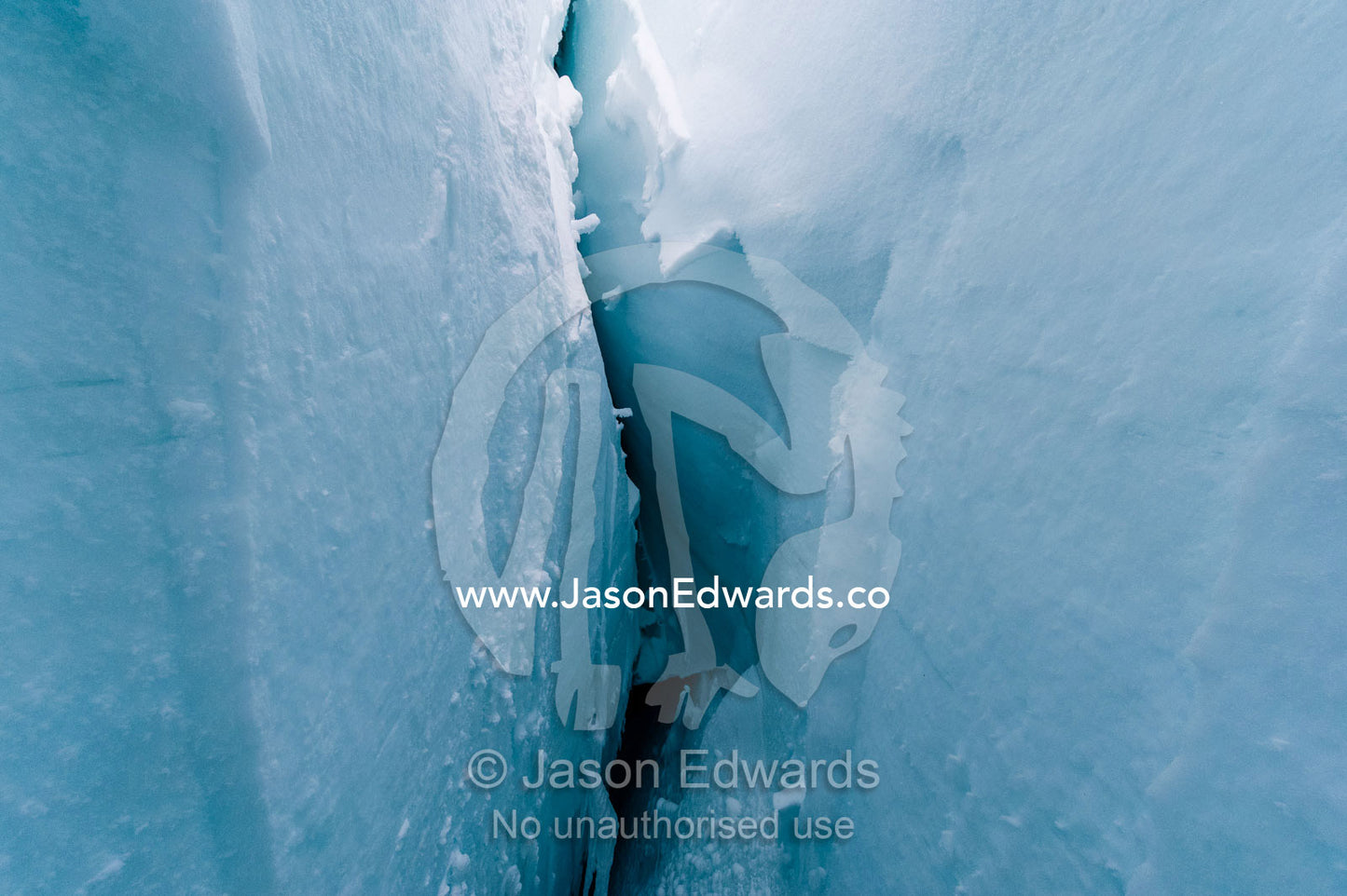 The cavernous and sheer icy walls of a crevasse on the slopes of Mount Erebus in Antarctica. Silver City Ice Fall, Hut Point Peninsula, Ross Island Antarctica.