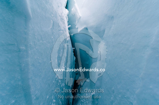 The cavernous and sheer icy walls of a crevasse on the slopes of Mount Erebus in Antarctica. Silver City Ice Fall, Hut Point Peninsula, Ross Island Antarctica.