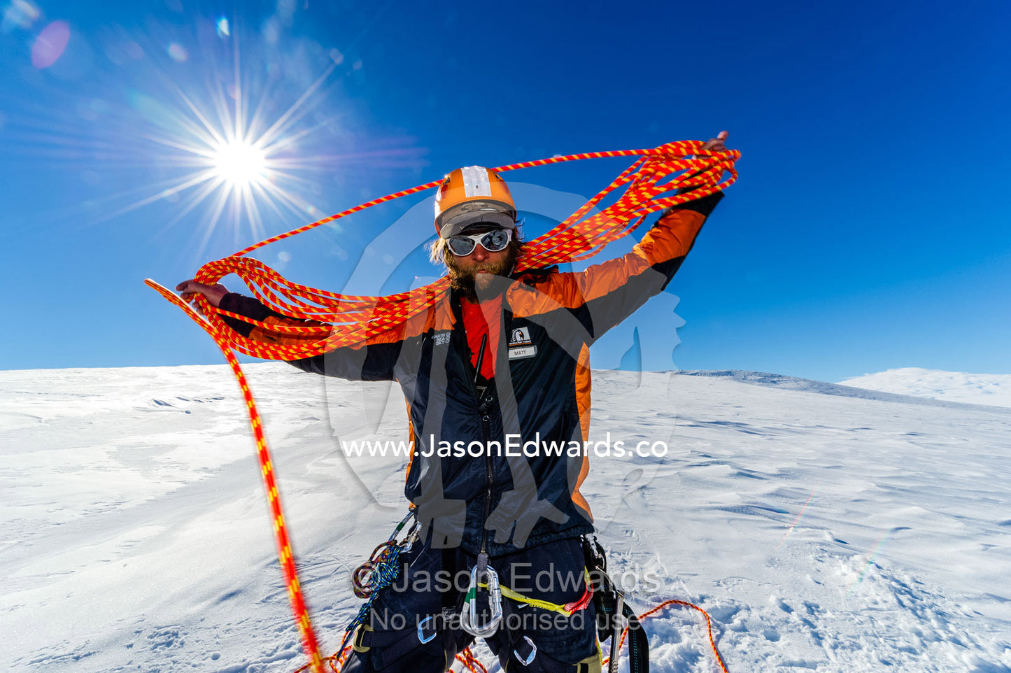 Ice guides coiling ropes after entering a crevasse on the slopes of Mount Erebus in Antarctica. Silver City Ice Fall, Hut Point Peninsula, Ross Island Antarctica.