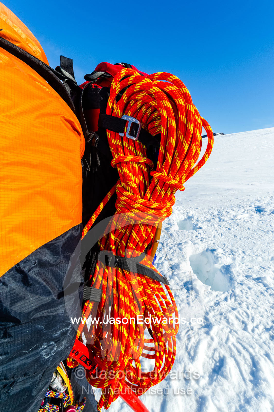 Ice guides coiled ropes after entering a crevasse on the slopes of Mount Erebus in Antarctica. Silver City Ice Fall, Hut Point Peninsula, Ross Island Antarctica.
