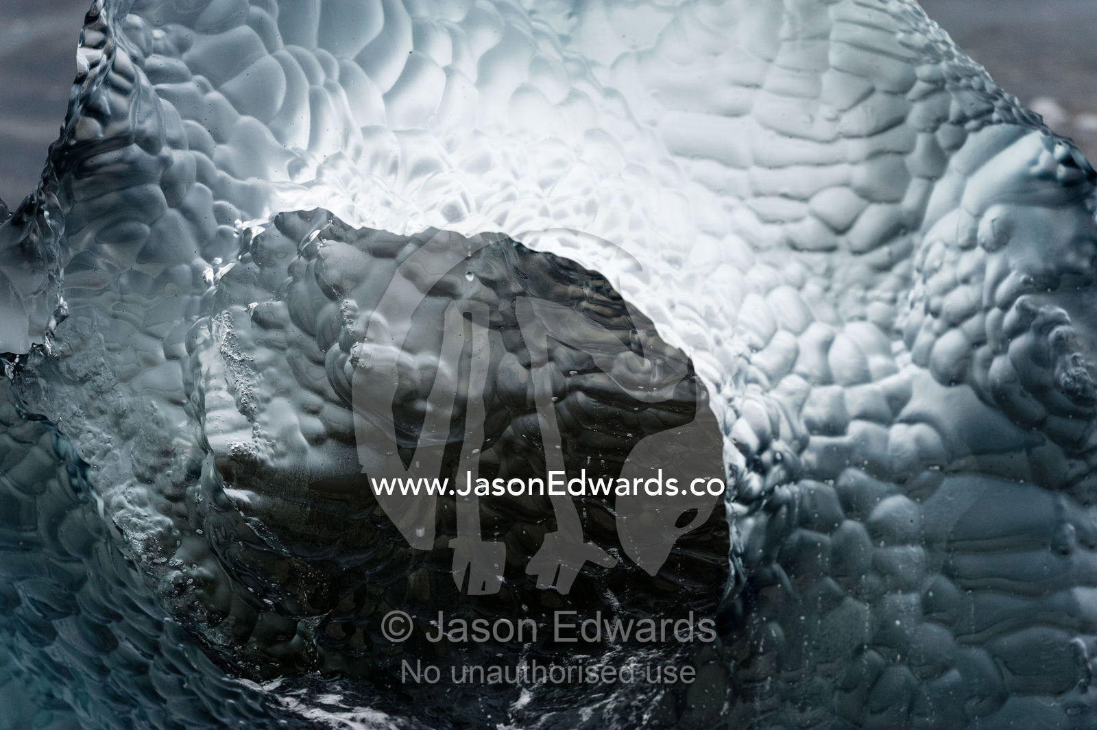 Wave motion has polished an iceberg into a sculpture of fresh water. Caughley Beach, Cape Bird, Ross Island, Antarctica.